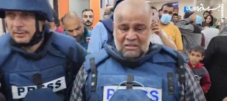 لحظه خداحافظی خبرنگار الجزیره با پیکر پسرش +فیلم