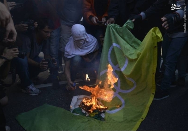 عکس:: پرچم المپیک به آتش کشیده شد