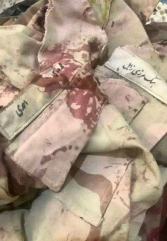 عکس| لباس غرق در خون شهید محمد مهدی احمدی که توسط طالبان به شهادت رسید